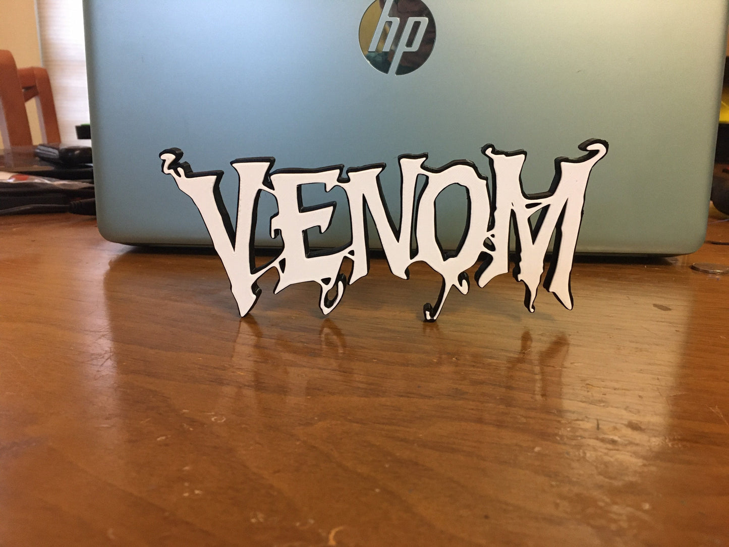 Venom logo/shelf display