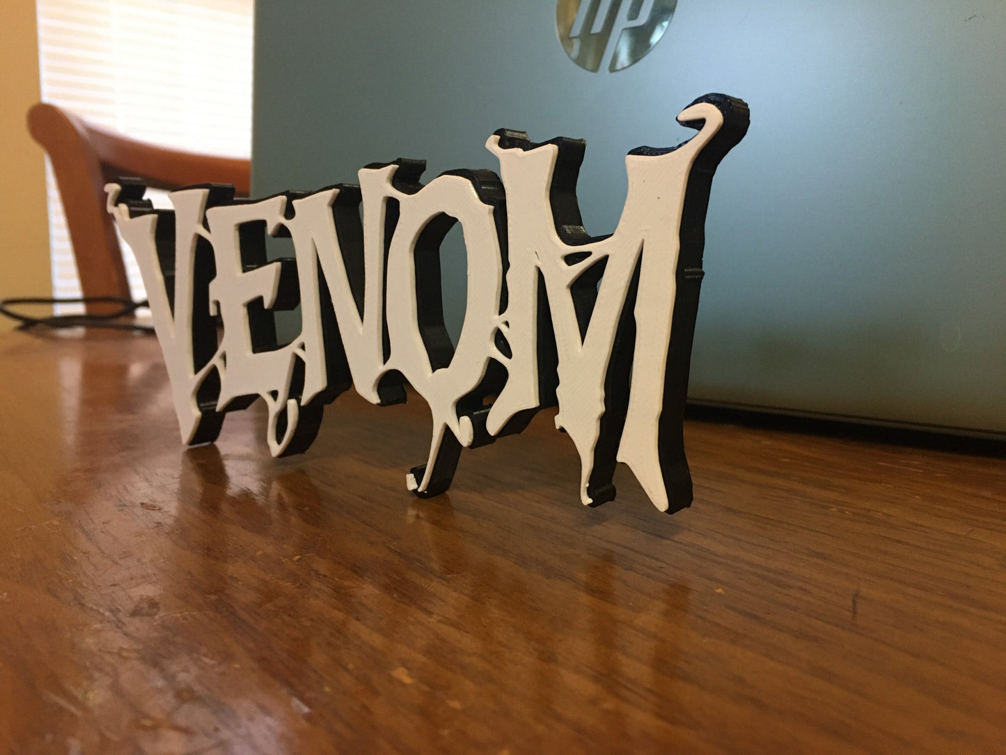 Venom logo/shelf display