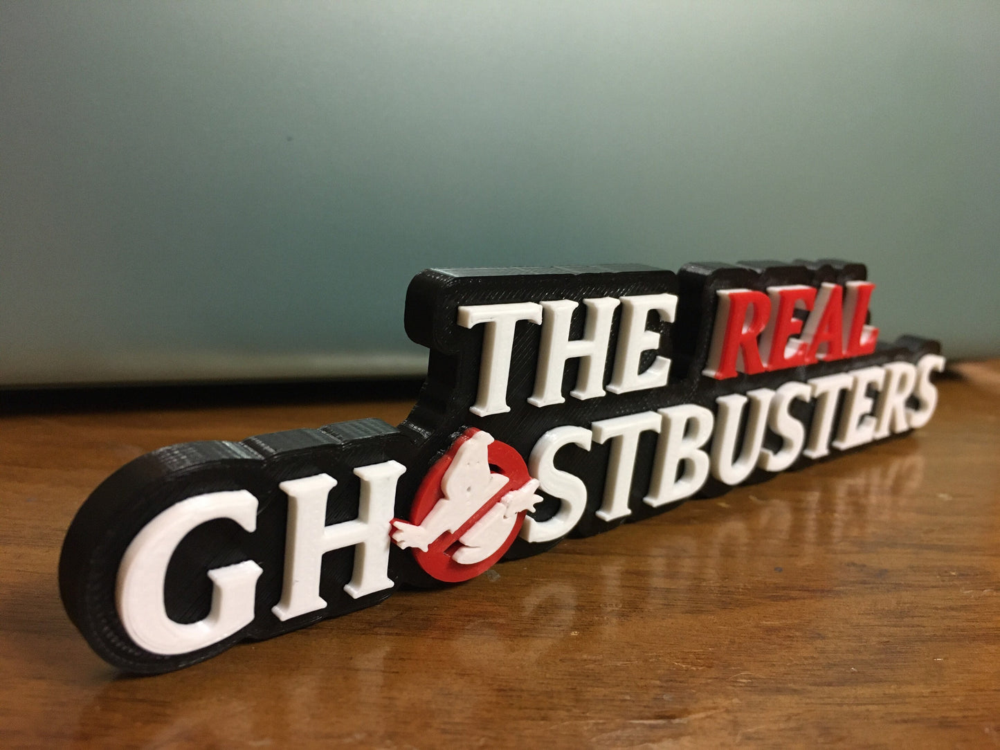 The Real Ghostbusters logo/shelf display