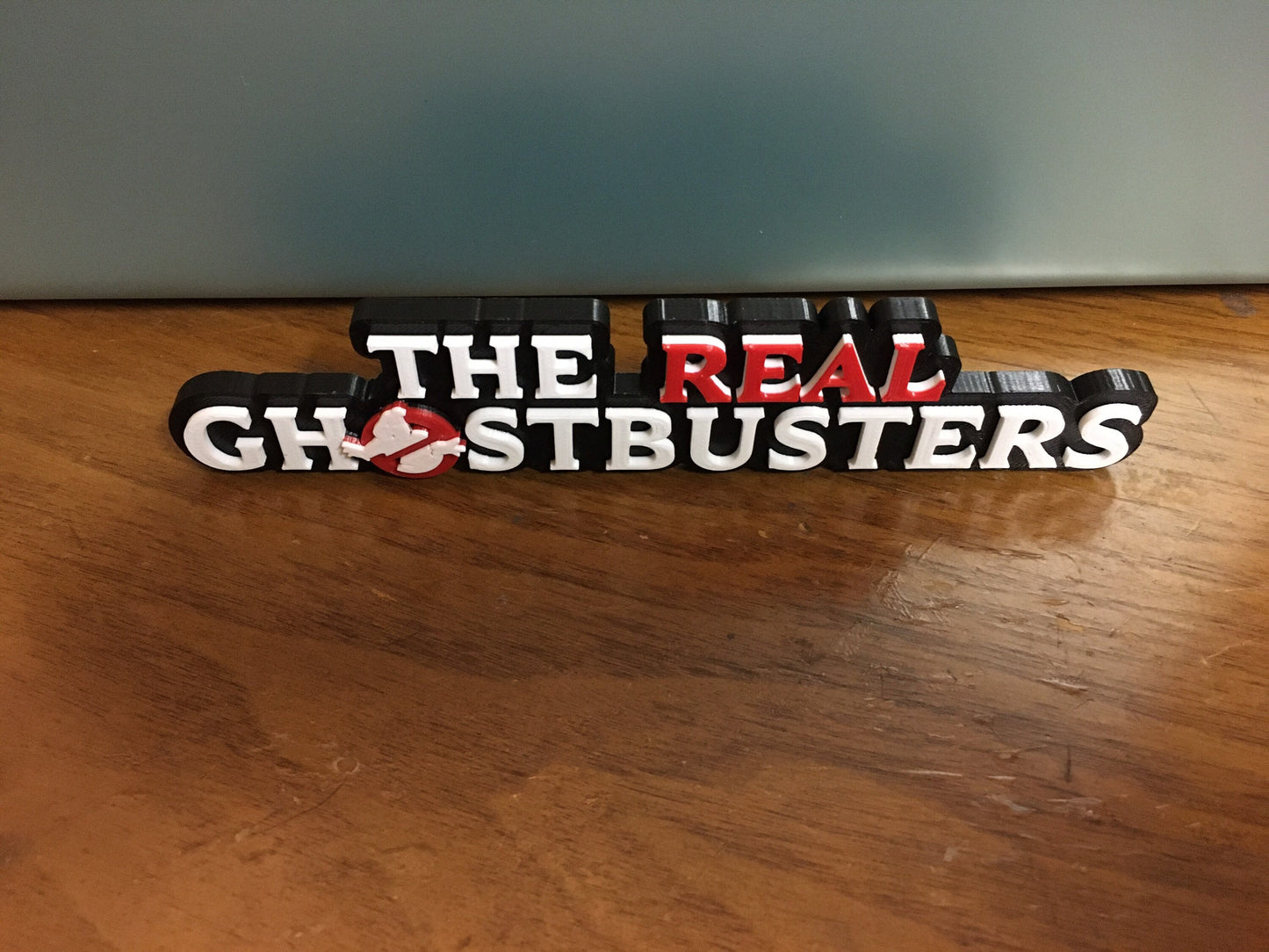 The Real Ghostbusters logo/shelf display