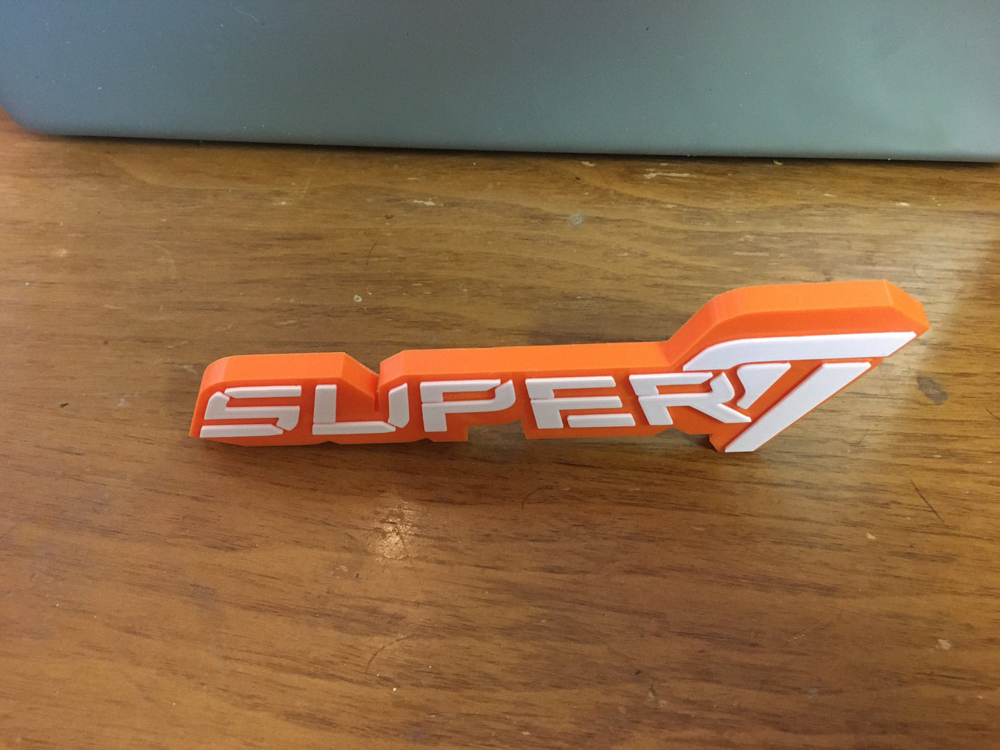 SUPER 7 logo/shelf display