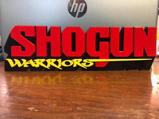 Shogun Warriors logo/shelf display