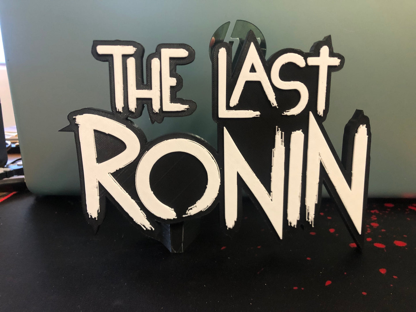 The Last Ronin logo/shelf display