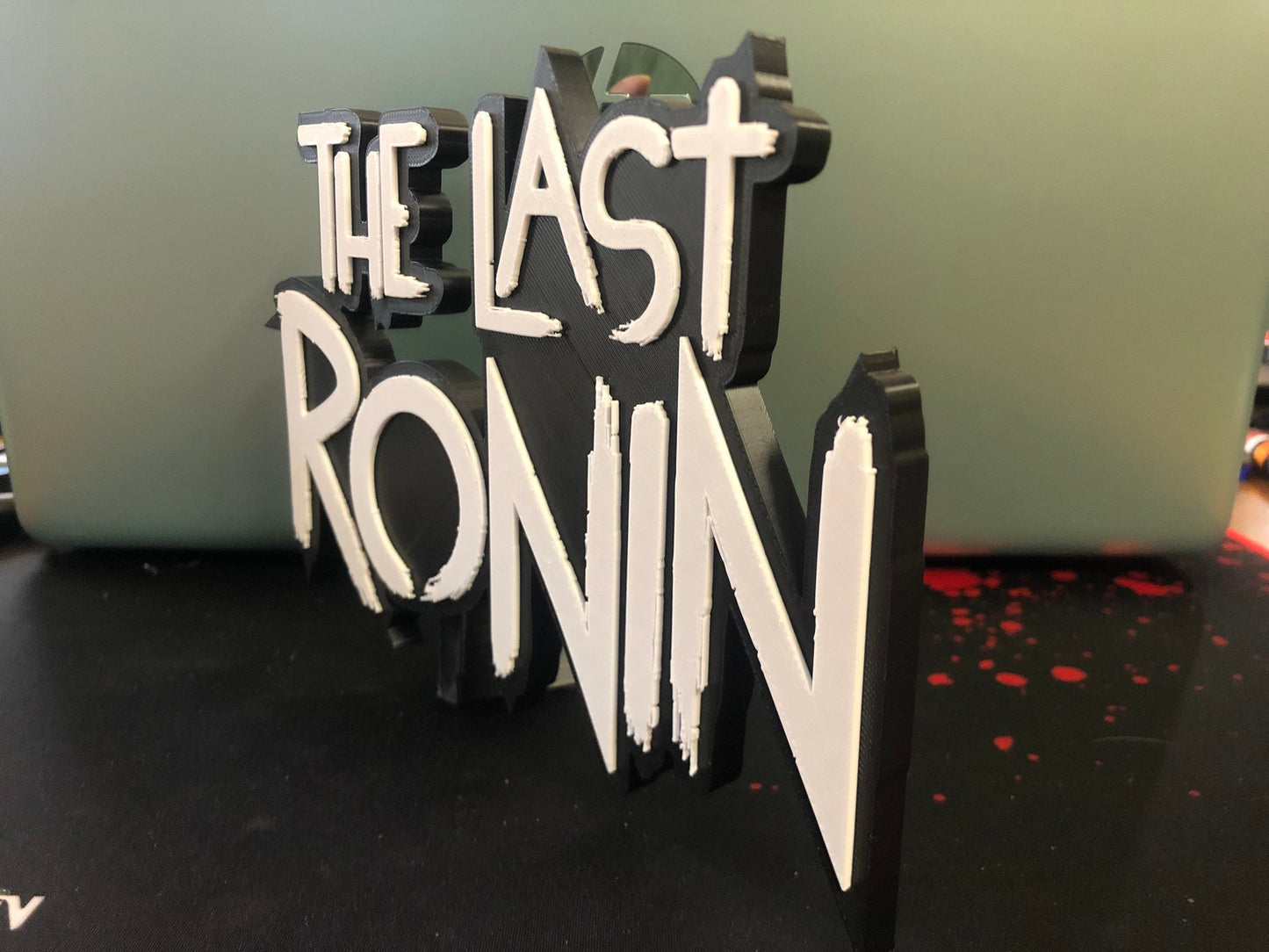 The Last Ronin logo/shelf display