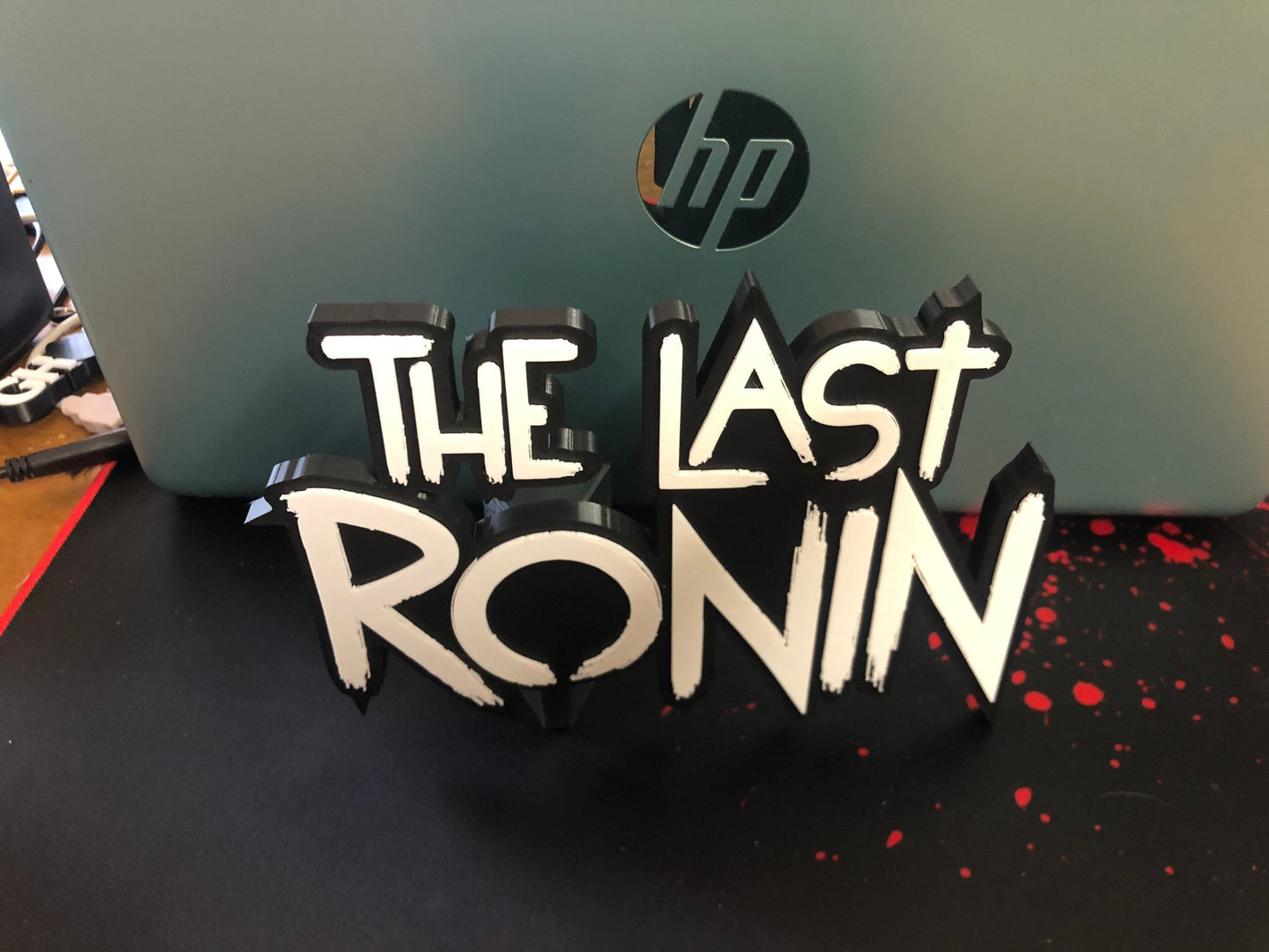 The Last Ronin logo/shelf display