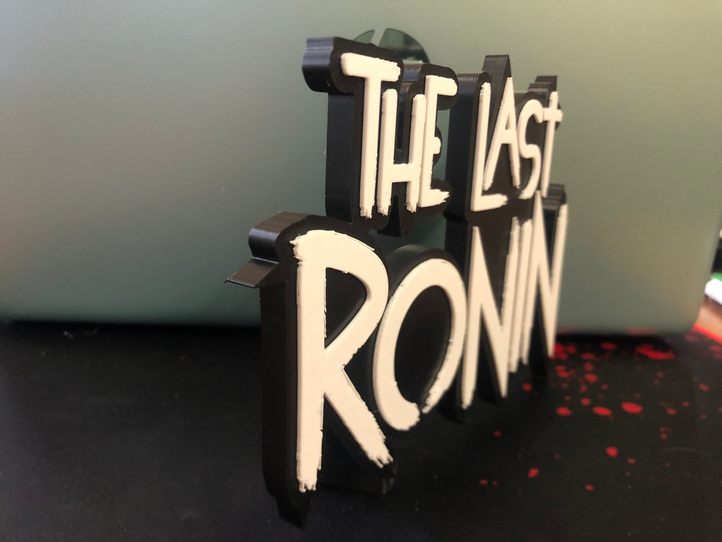 The Last Ronin logo/shelf display