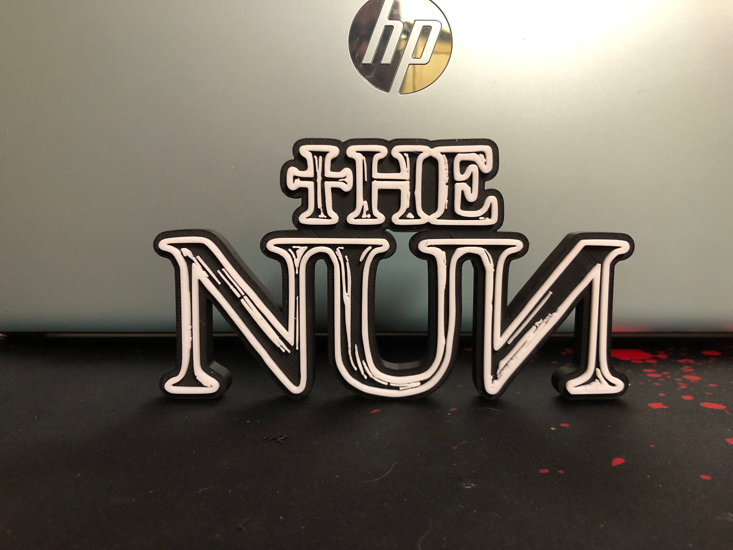 The Nun logo/shelf display