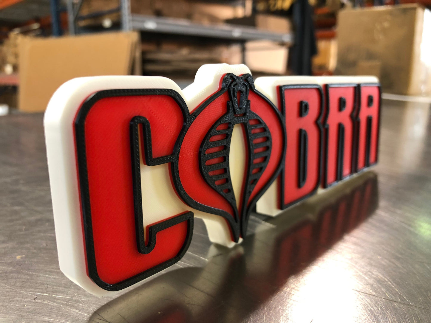 V2 Cobra logo/shelf display