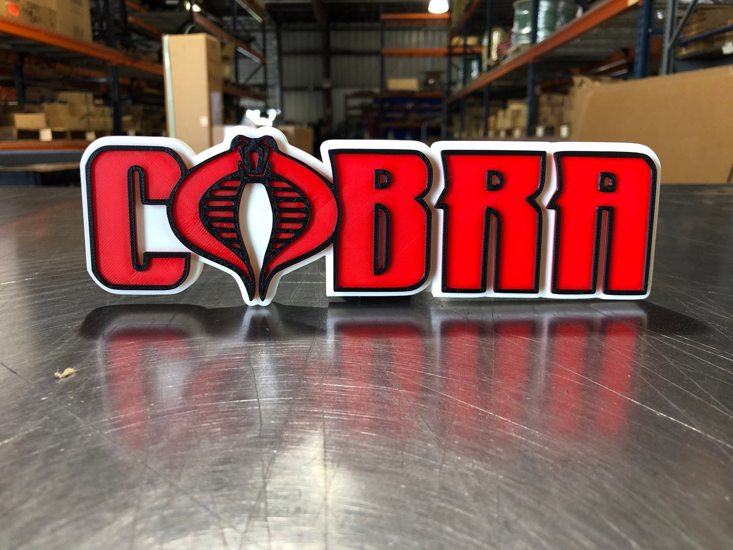 V2 Cobra logo/shelf display