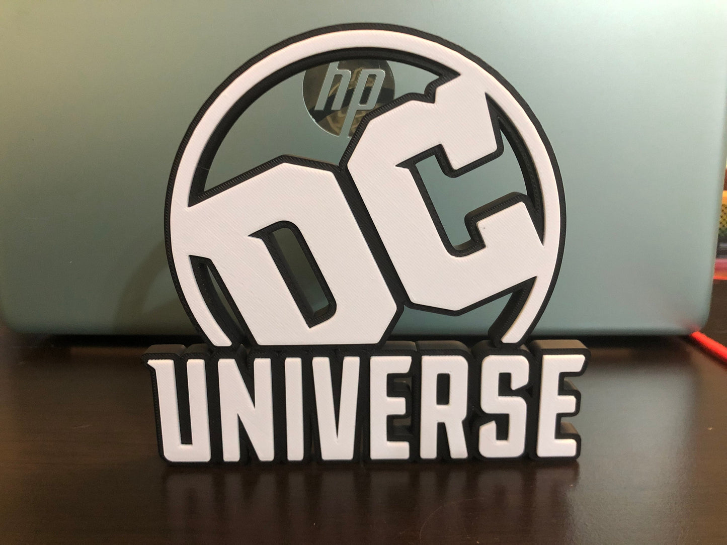 DC UNIVERSE logo/shelf display