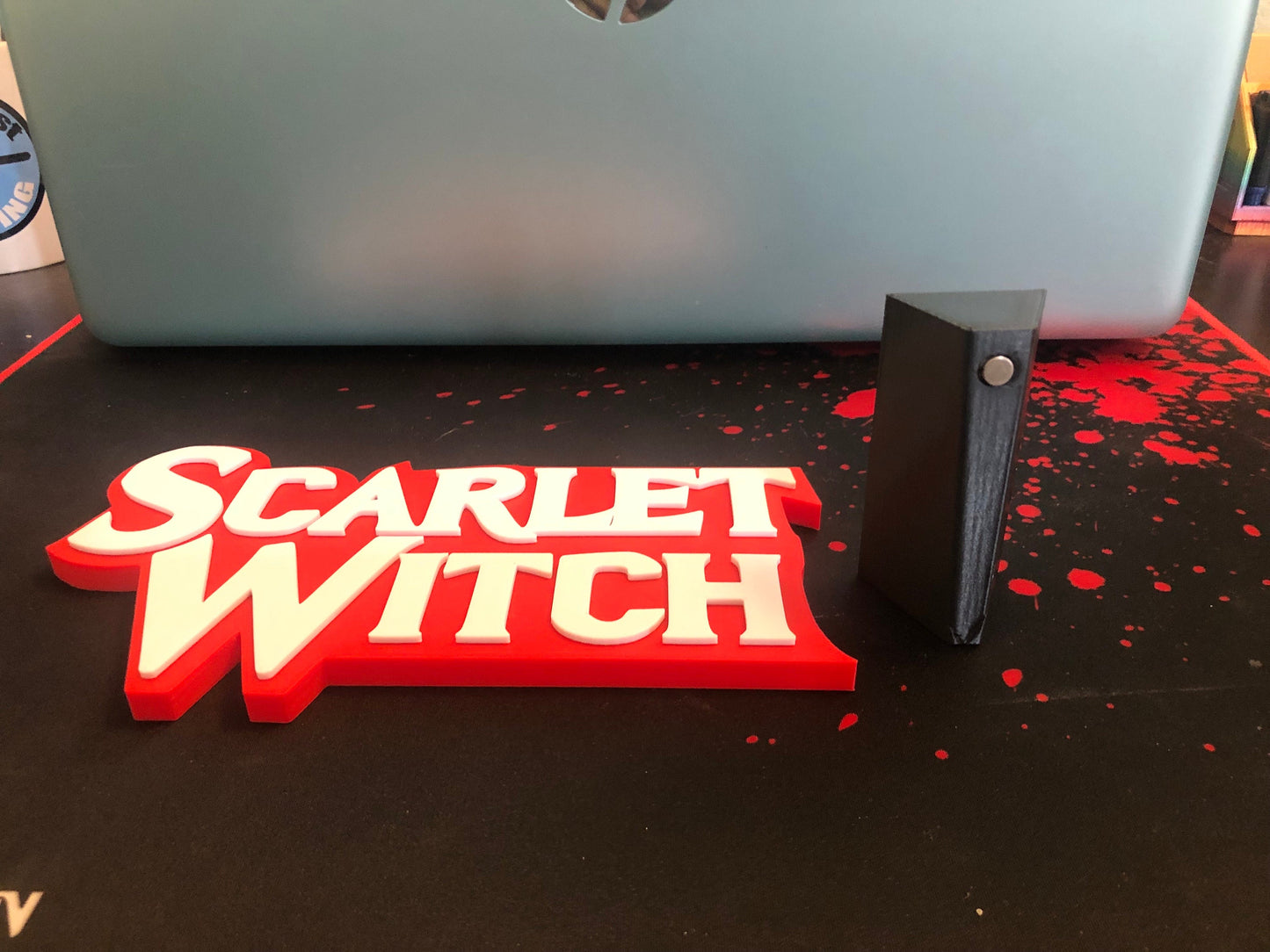 Scarlet Witch logo/shelf display