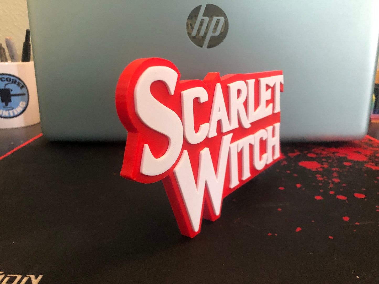 Scarlet Witch logo/shelf display